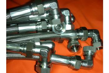 Flexible hoses with stainless steel fittings and compensators